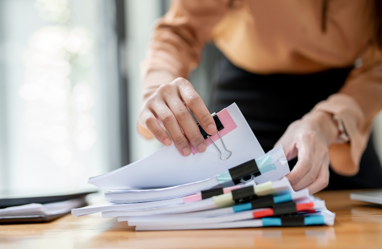 Woman sorting through papers
